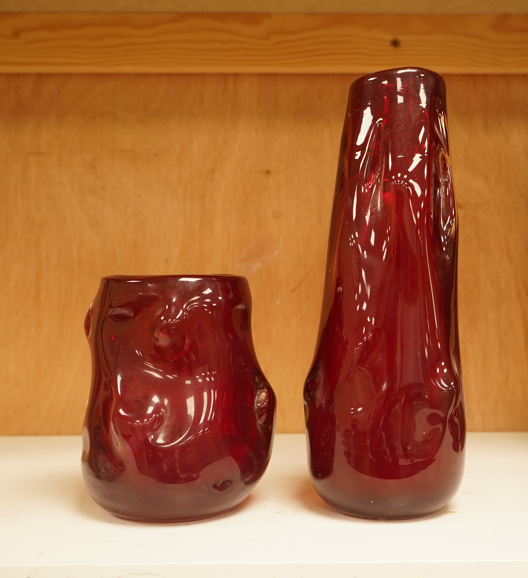 Two Whitefriars ruby red ‘knobbly’ glass vases, tallest 25cm